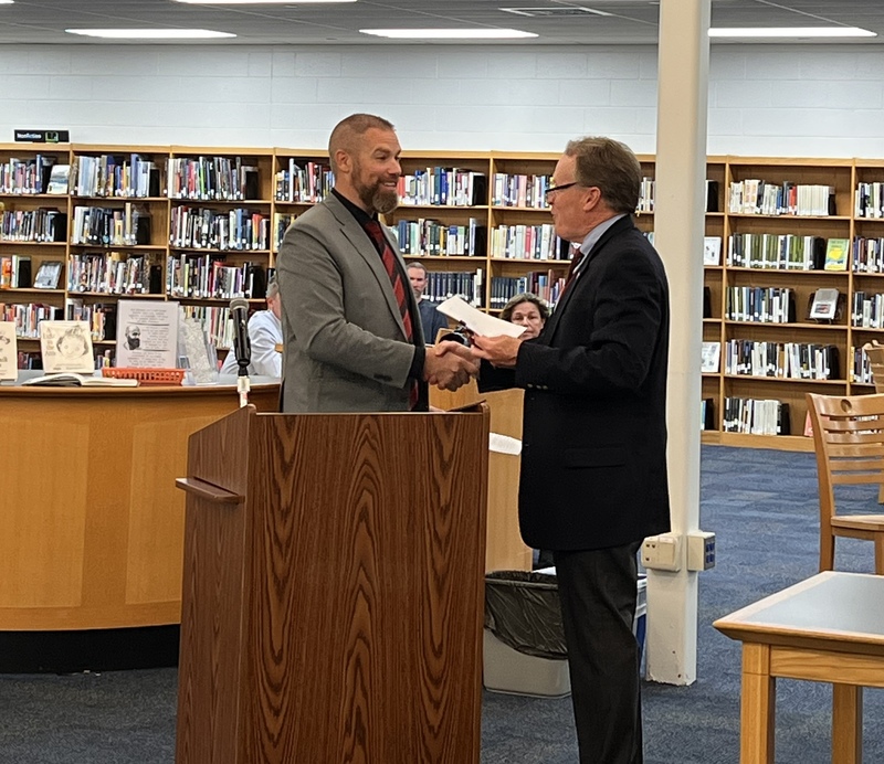 Dr. Brian Latwis shaking hands with Kevin Barnes