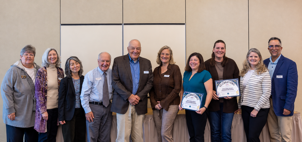 A picture of the ESD board and cabinet members with Shana Bradley and Heather Sweet of the Ocosta School District.