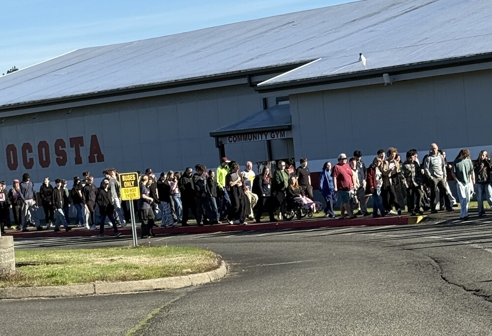 group of students walking in front of the Ocosta Community Gym