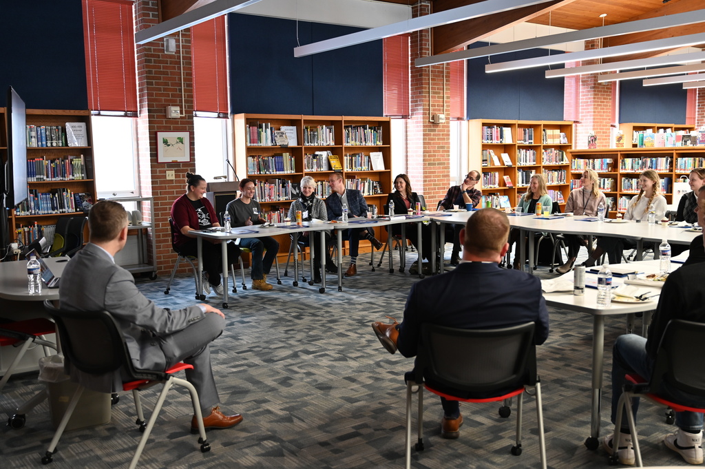 Students engage in conversation with school leaders, board members, and local legislators.