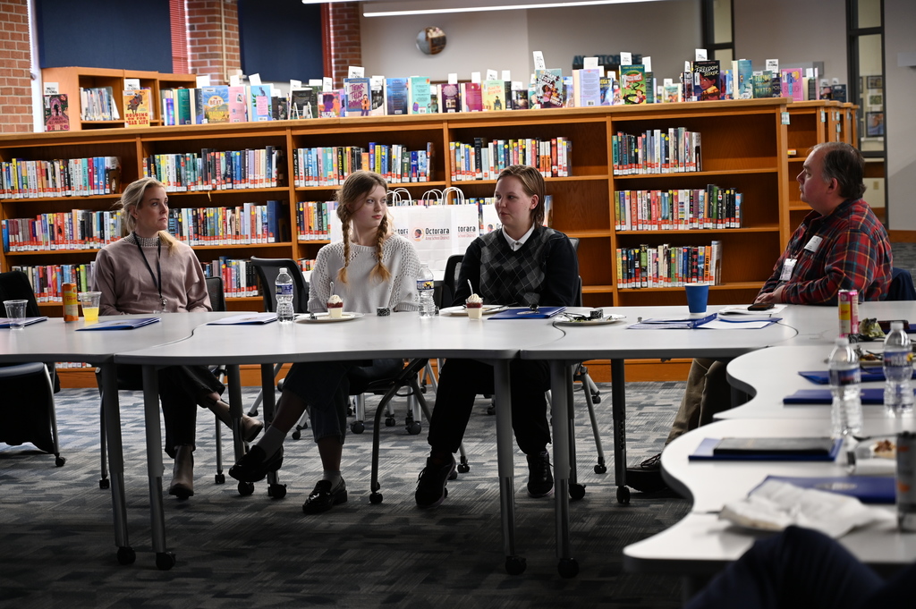 Students engage in conversation with school leaders, board members, and local legislators.