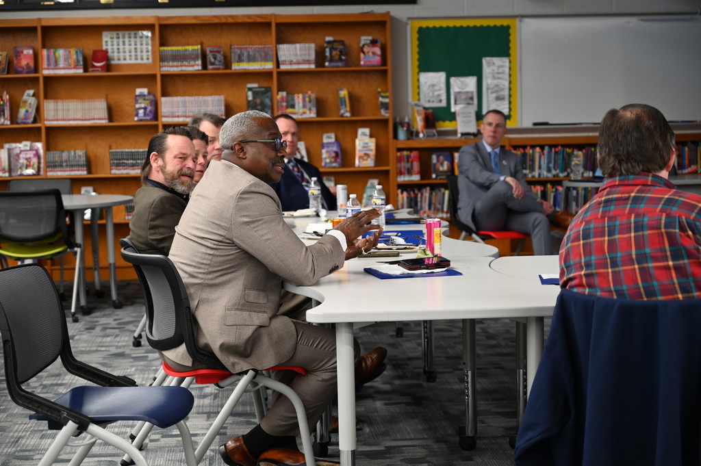 Local legislators engage in conversation. 