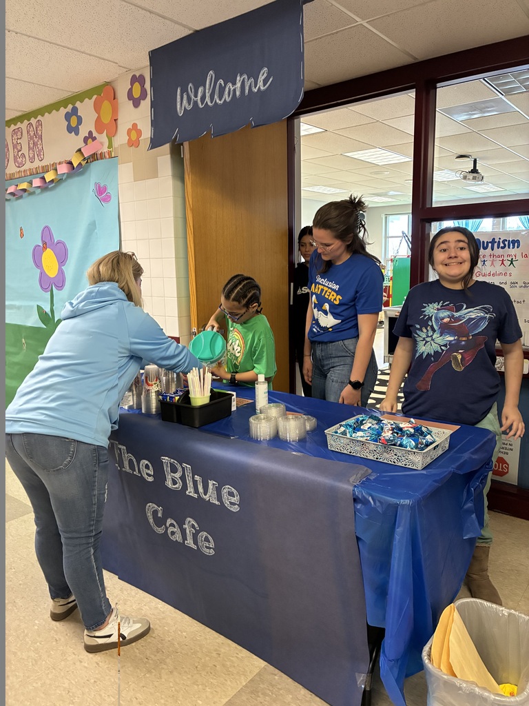 students work together at The Blue Cafe, learning new skills