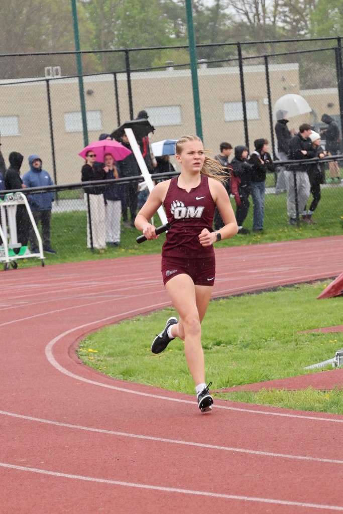 student runner on track