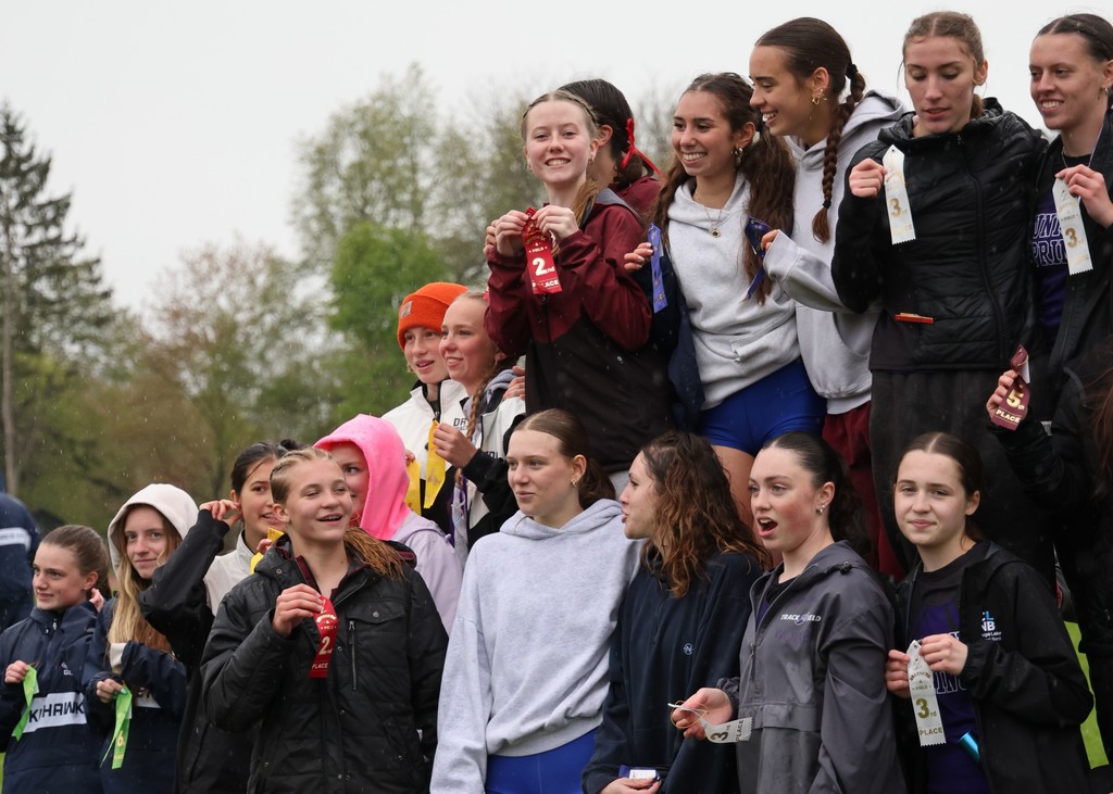 students holding ribbons