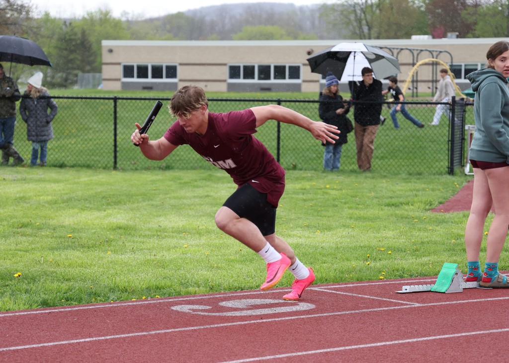 student running on track
