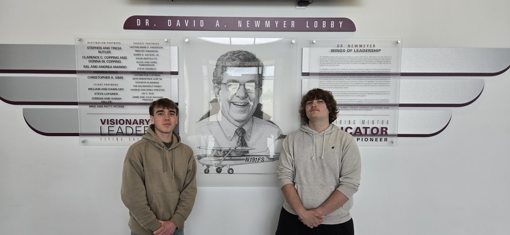 Students who took the Part 107 exam standing in front of the SIU-C airport lobby