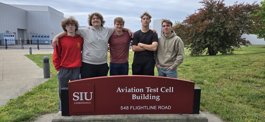 Students from our drones class standing behind the SIU-C School of Aviation Sign