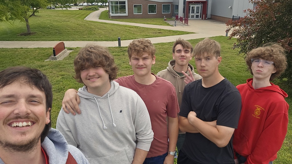 Students and their teacher, Mr. Barbee, standing in front of the SIU-C School of Aviation Building