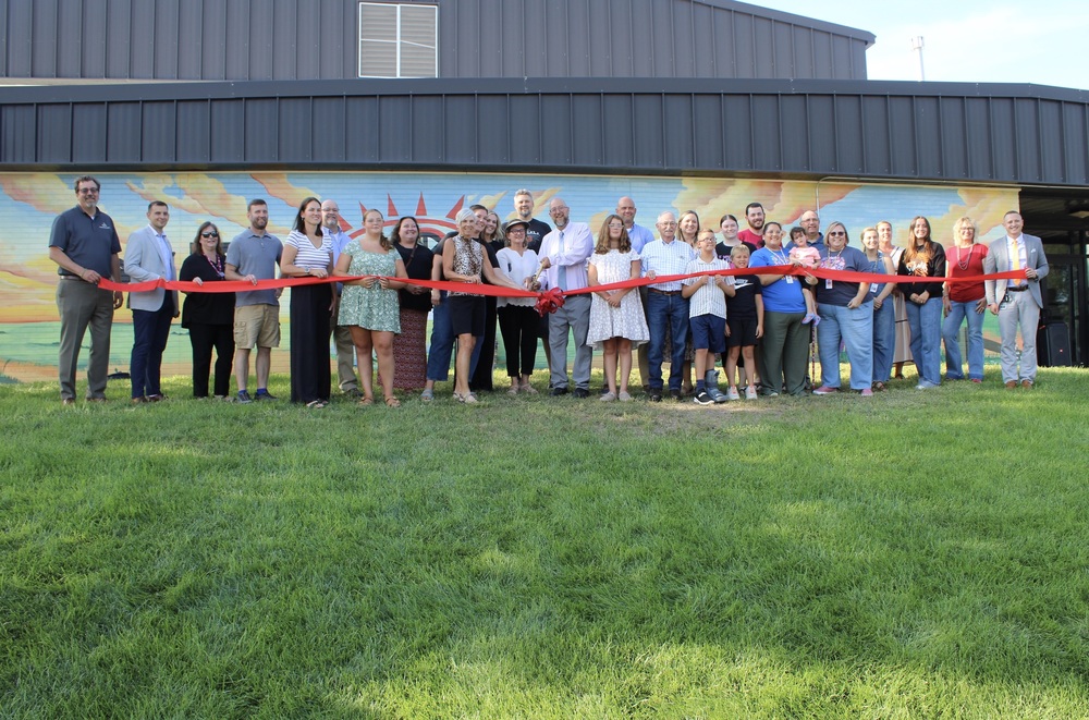 ribbon cutting ceremony with group of people