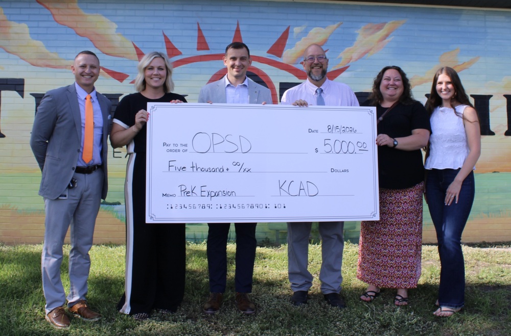 KCAD Donation - check photo with school employees