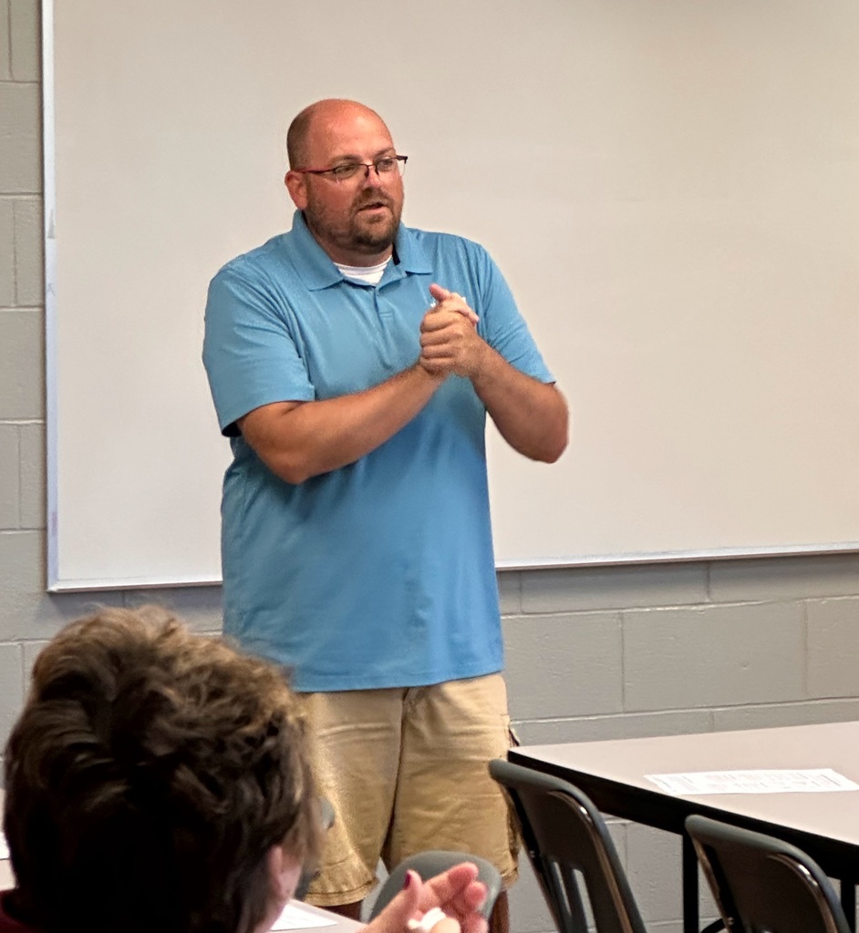 Ogallala Chamber of Commerce's Shawn Rubek talks to business leaders and OHS staff members.