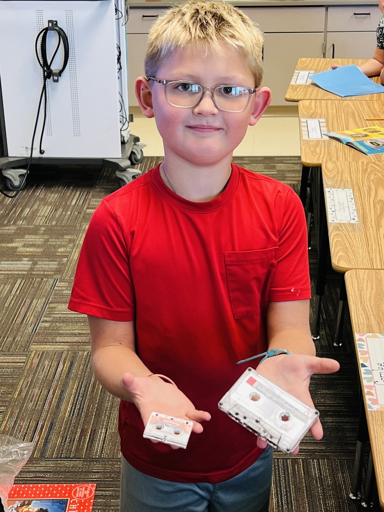 student with cassette tapes