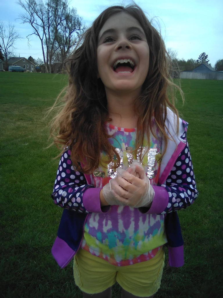 3rd grade students at park picking up trash