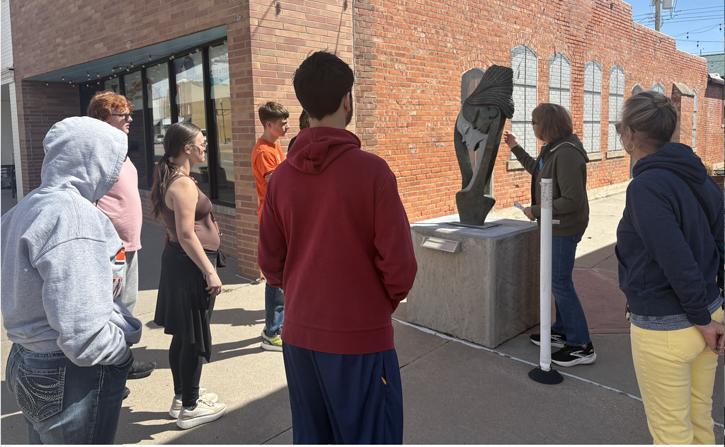 students on a sculpture walk