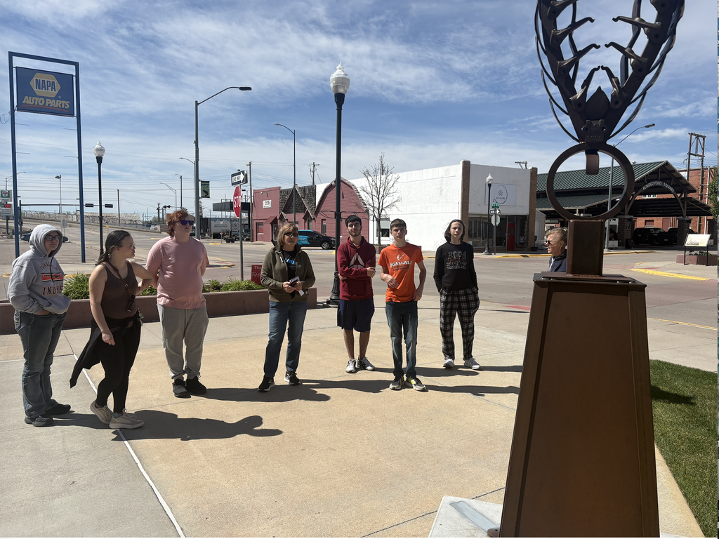 students on a sculpture walk