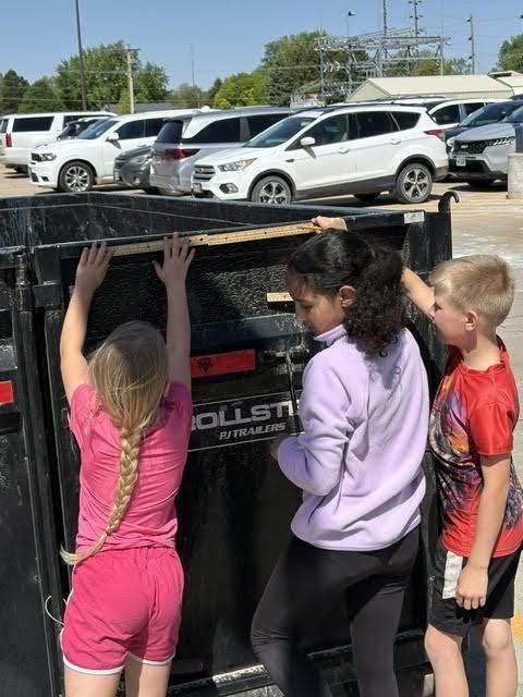 students doing a perimeter activity outdoors