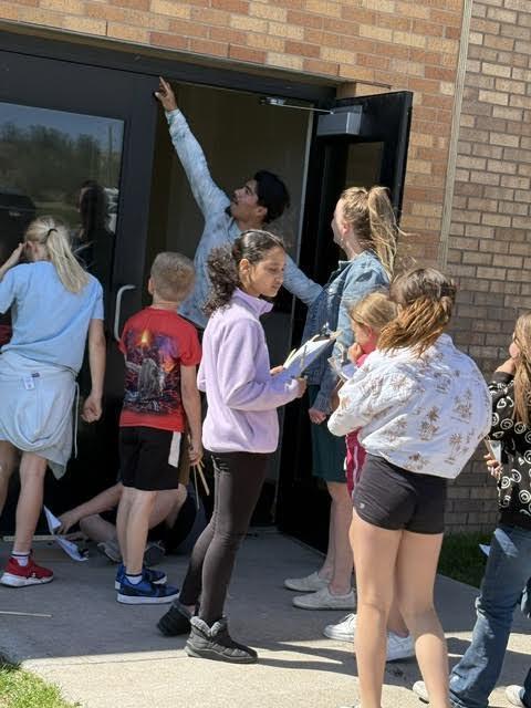 students doing a perimeter activity outdoors