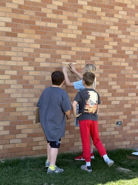 students doing a perimeter activity outdoors