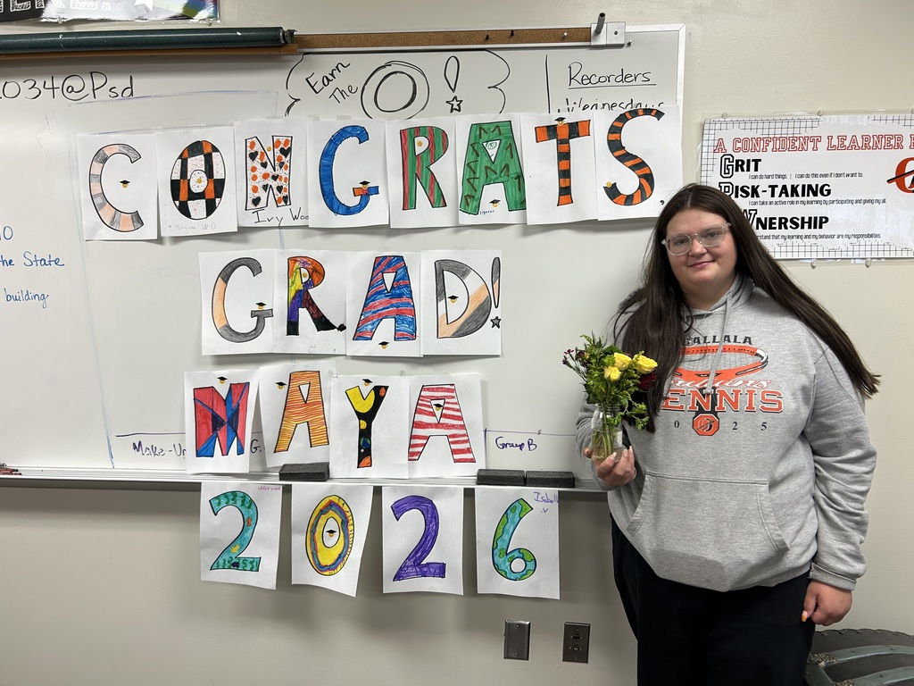 student aid with congrats sign