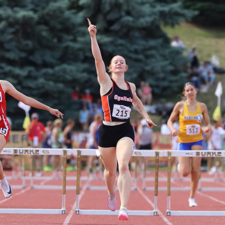 Shaydyn Rasby running hurdles
