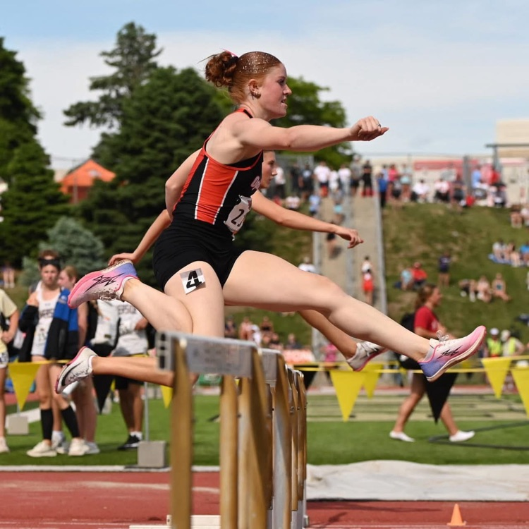 Shaydyn Rasby running hurdles