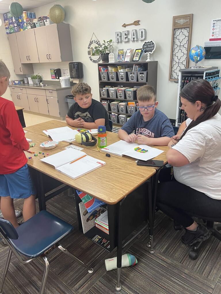 students counting linking cubes