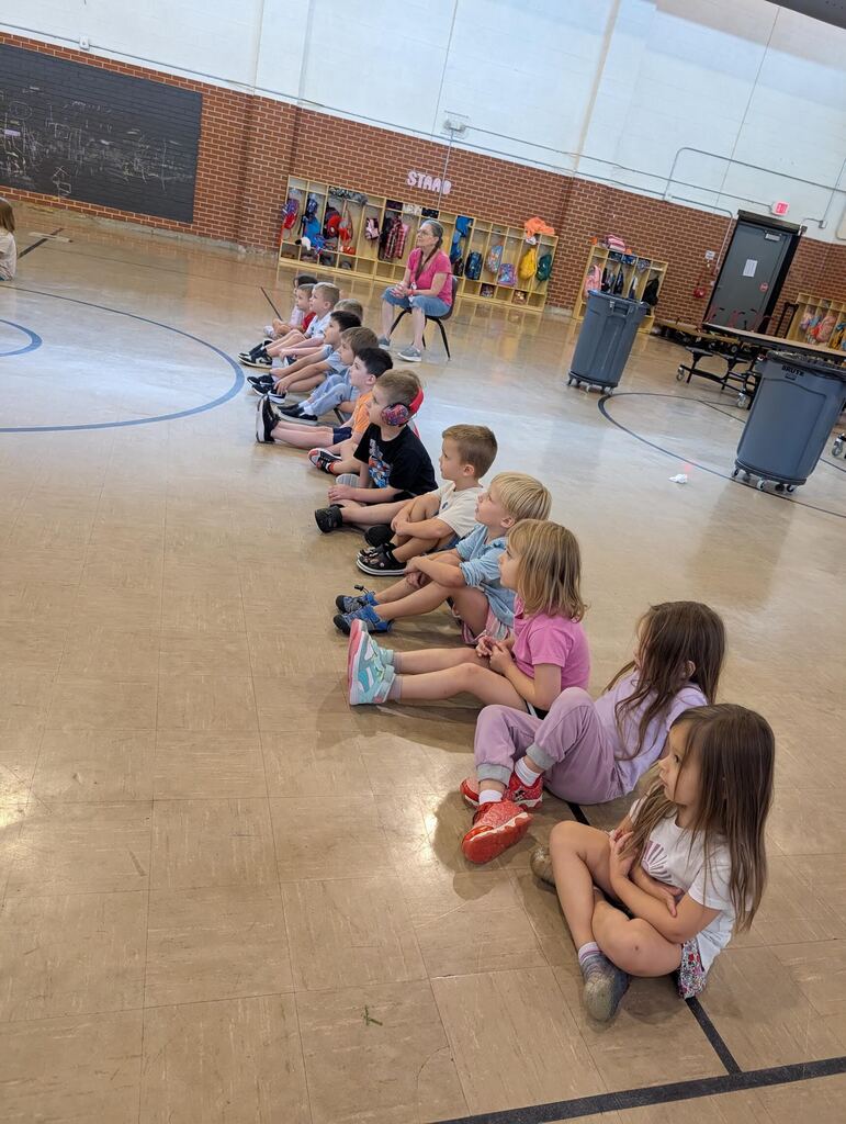tiny trails students sitting in line listening to music teacher