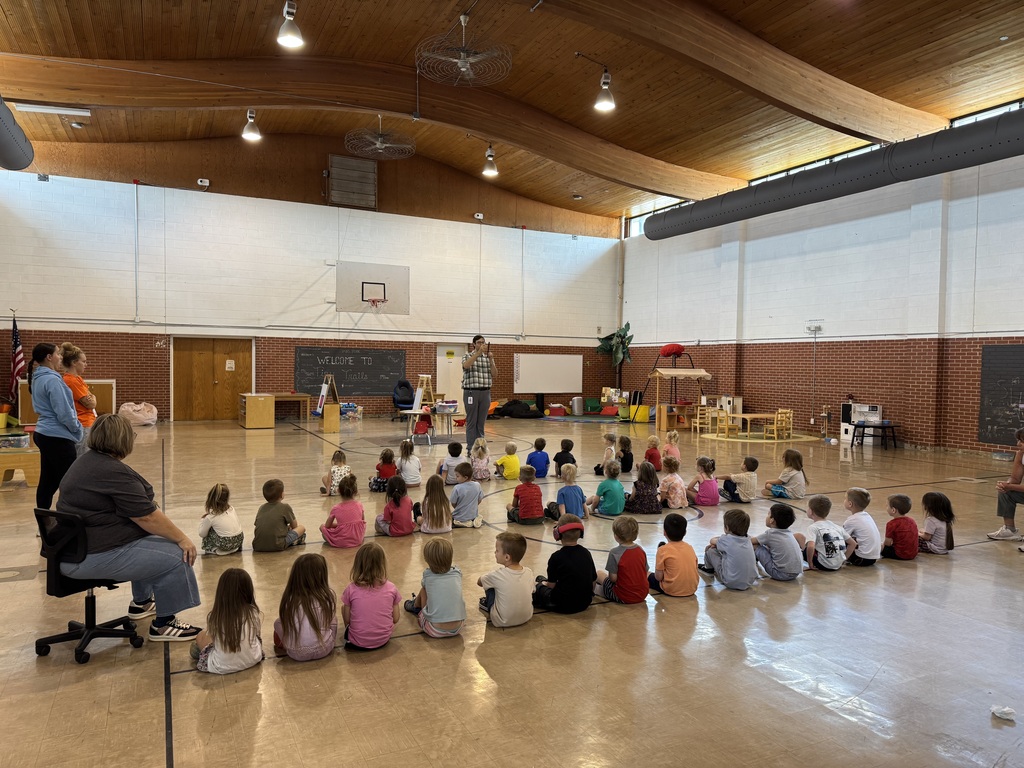 tiny trails students sitting in line listening to music teacher