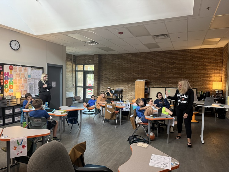 two teachers teaching asl to classroom of students 