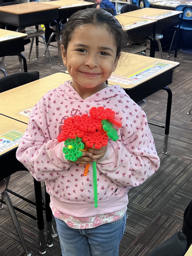 student holding kinex pieces