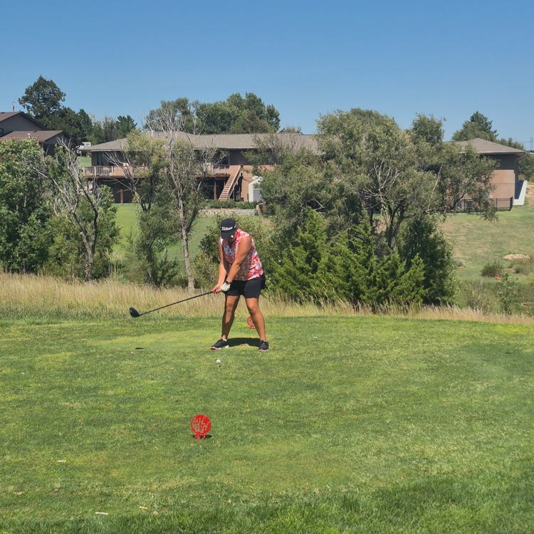 golfer swinging club