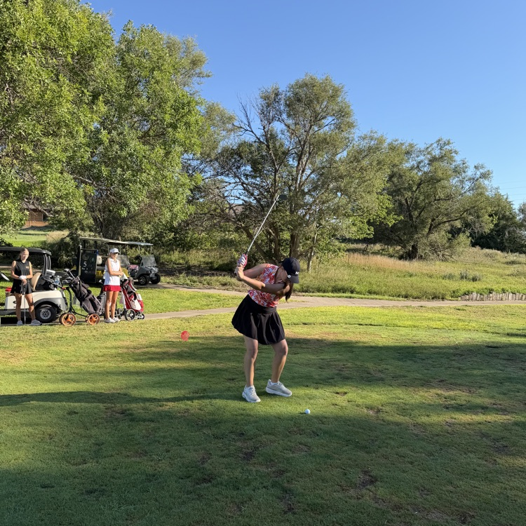 golfer swinging club