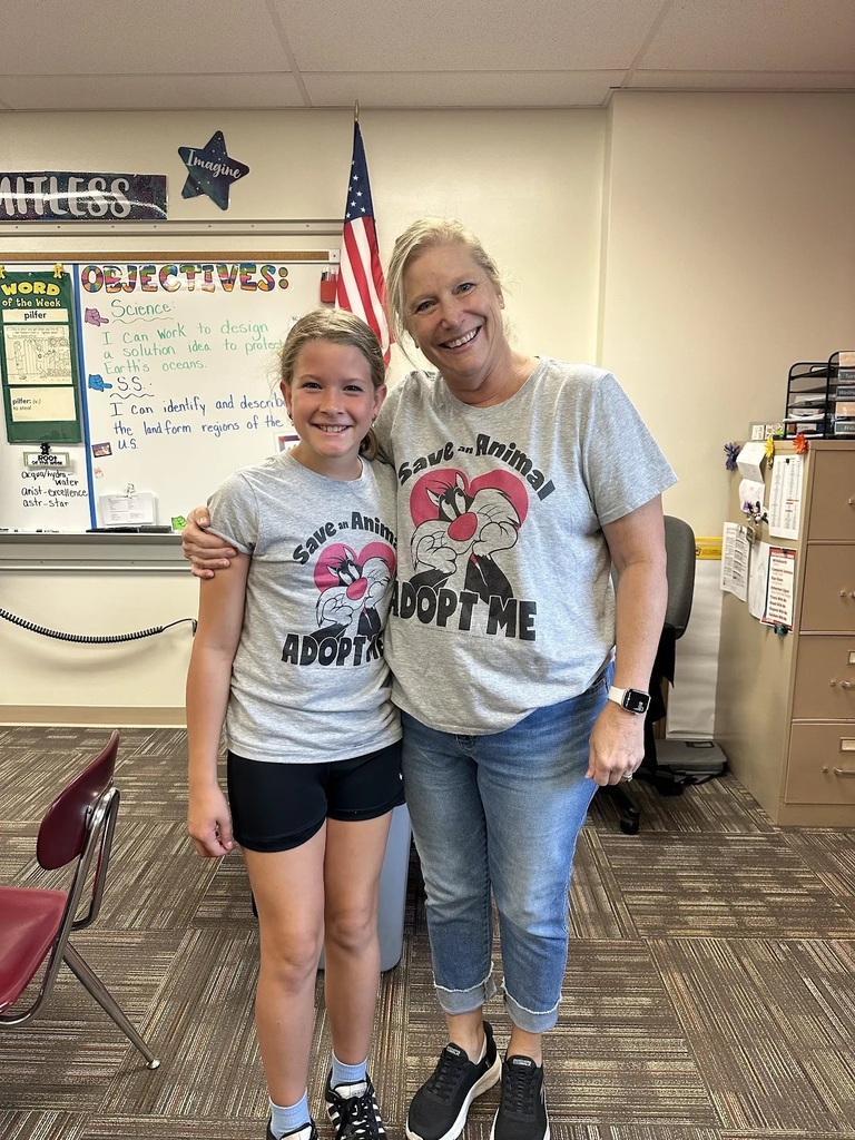 a student and teacher wearing matching sylvester the cat shirts