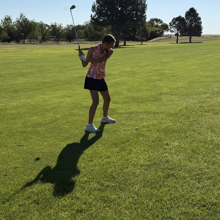 golfer swinging club