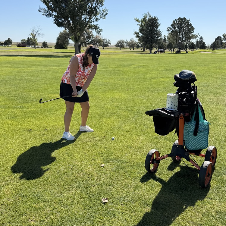 golfer swinging their club