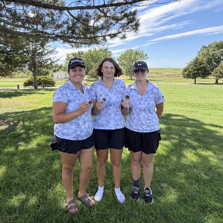 3 medals posing holding medals