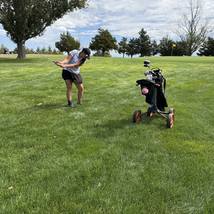 golfer swinging club