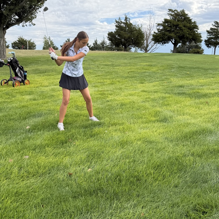 golfer swinging club