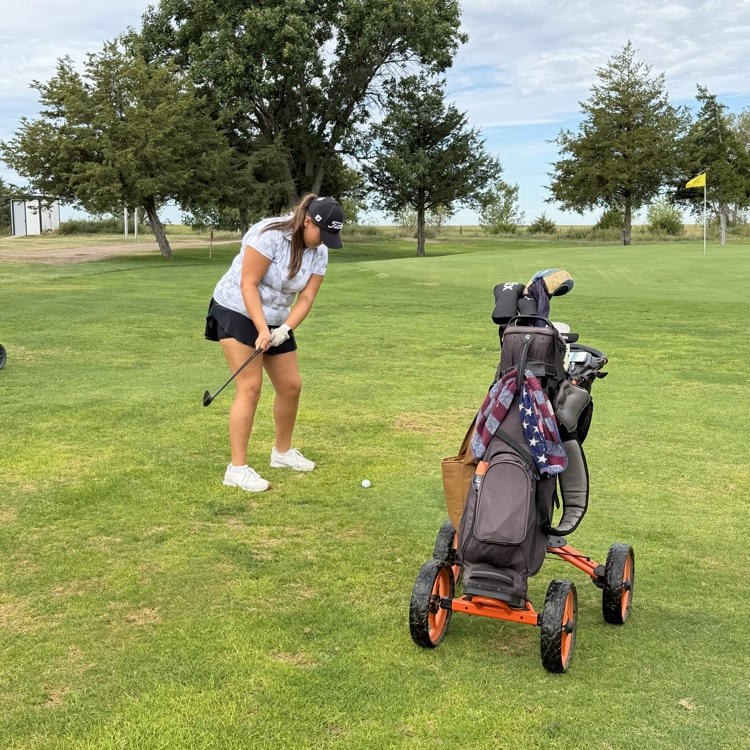 golfer swinging club