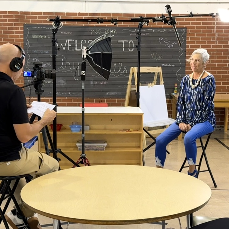 interview set up with man and woman sitting on stools