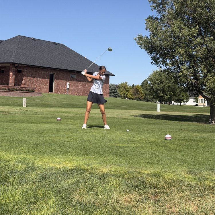 golfer swinging golf club