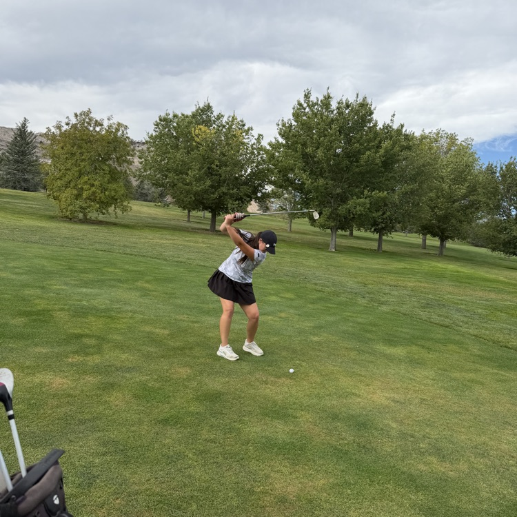 golfer swinging golf club