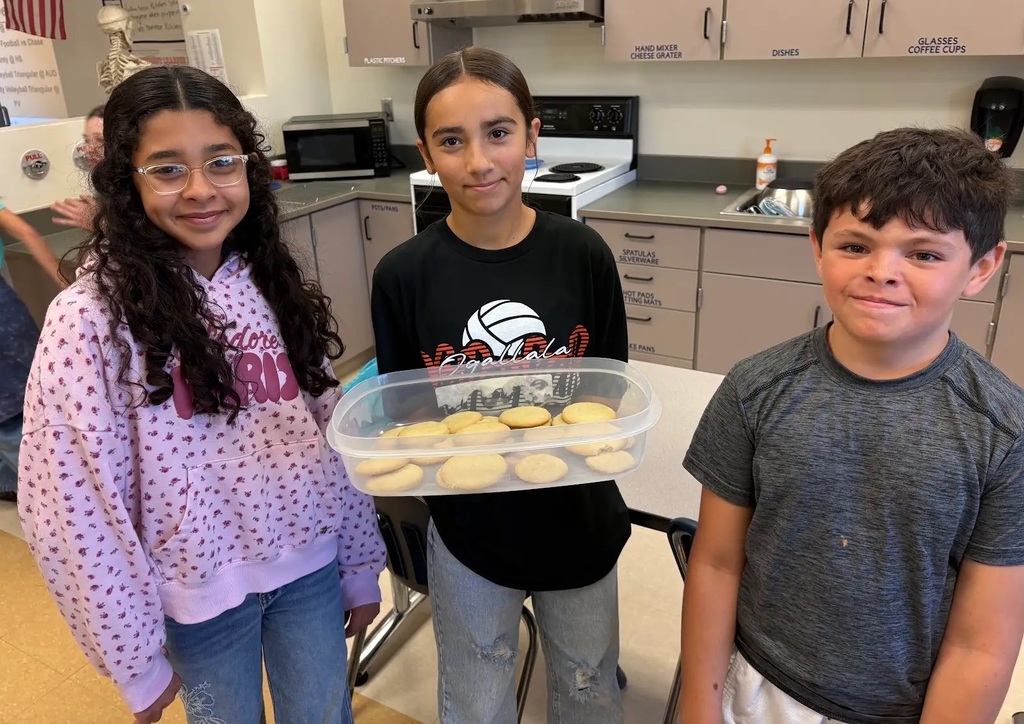 students holding their baked item