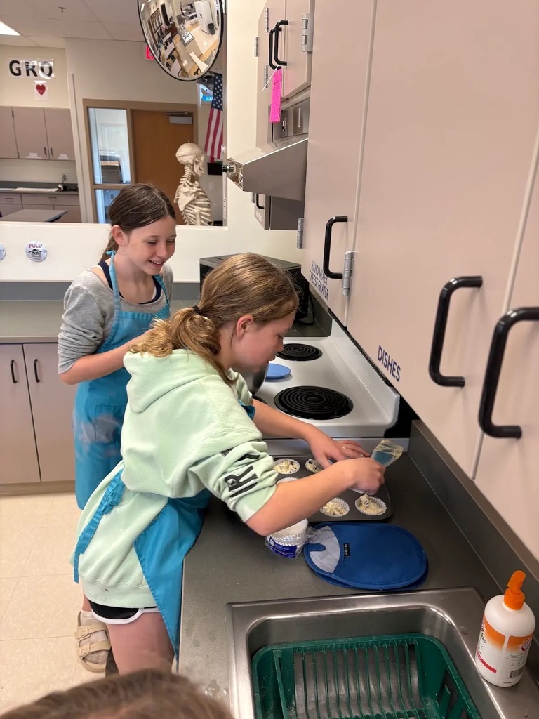 students holding their baked item