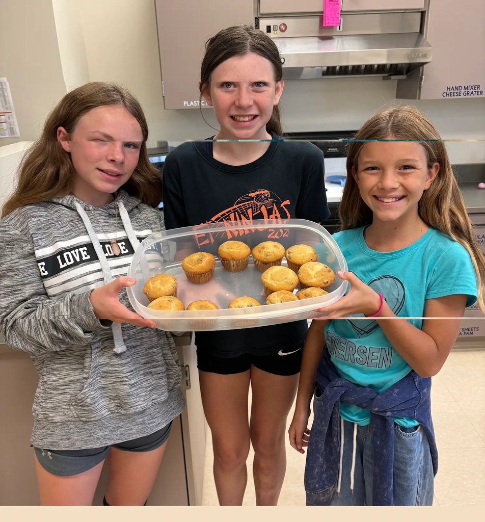 students holding their baked item