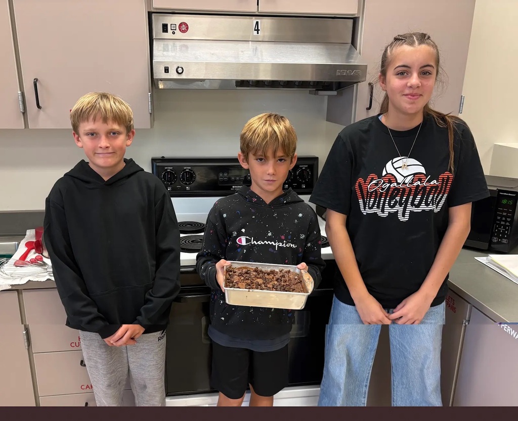 students holding their baked item