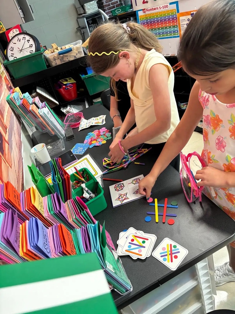 students building with math STEM bins