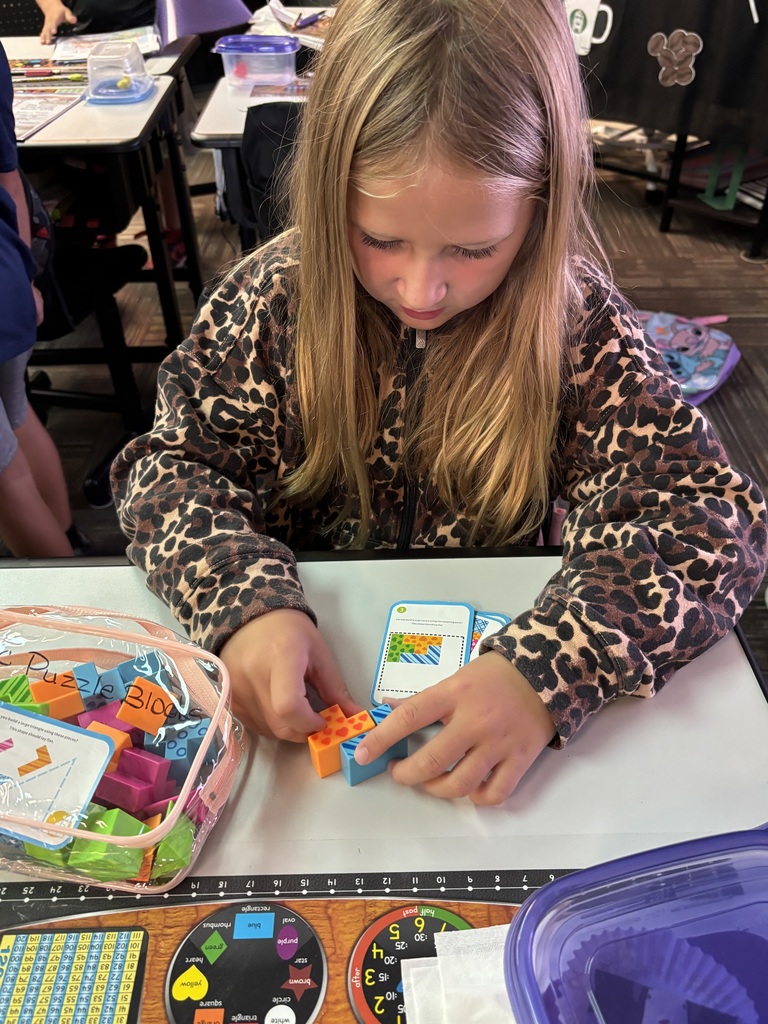 students building with math STEM bins