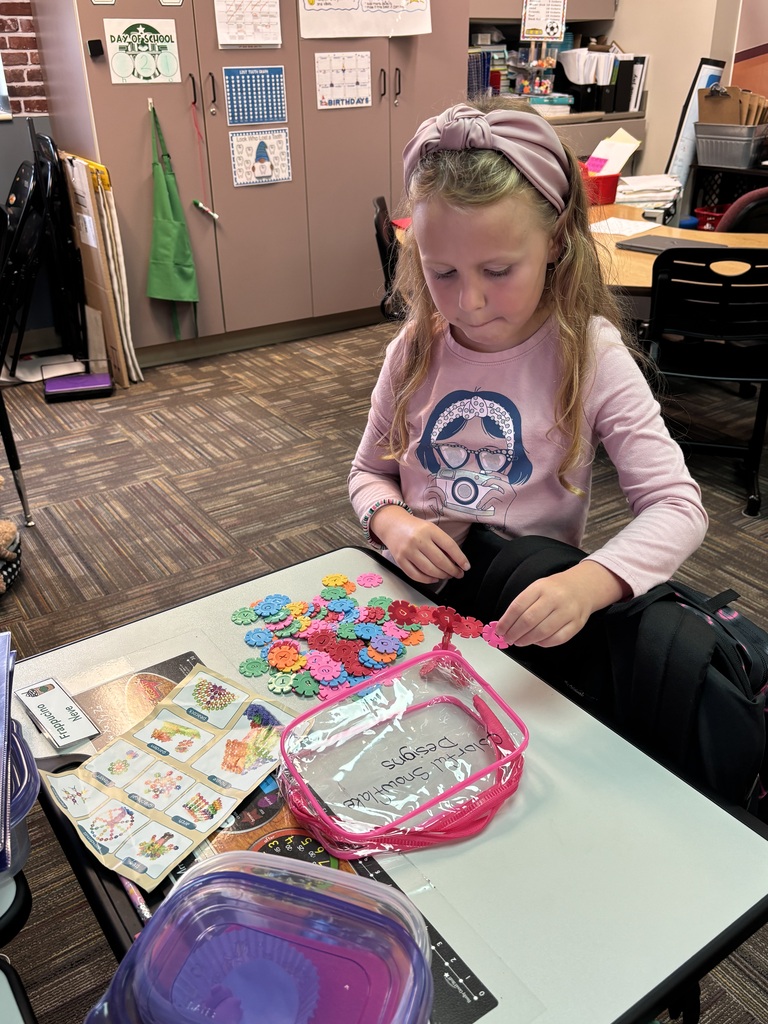 students building with math STEM bins